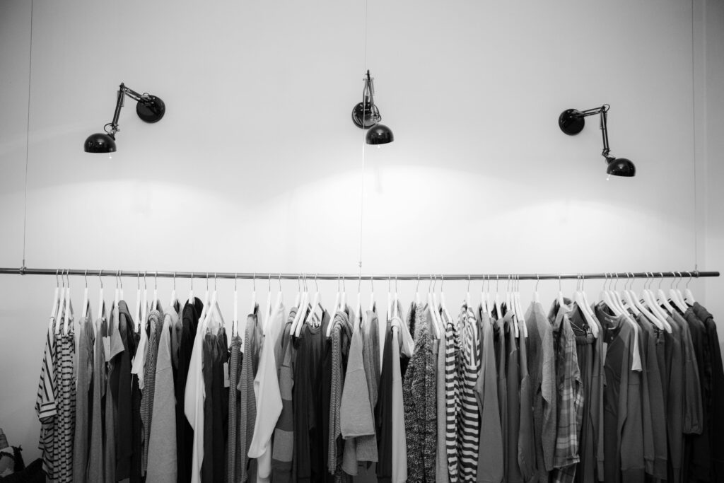 pexels photo 1884584 1884584 Minimalist black and white clothing display in a stylish boutique setting.